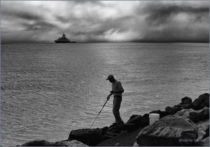 Fisherman and Yacht by Sabine Stetson